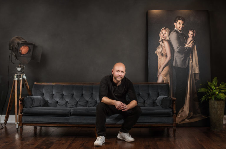 Neal Urban poses with life size canvas
