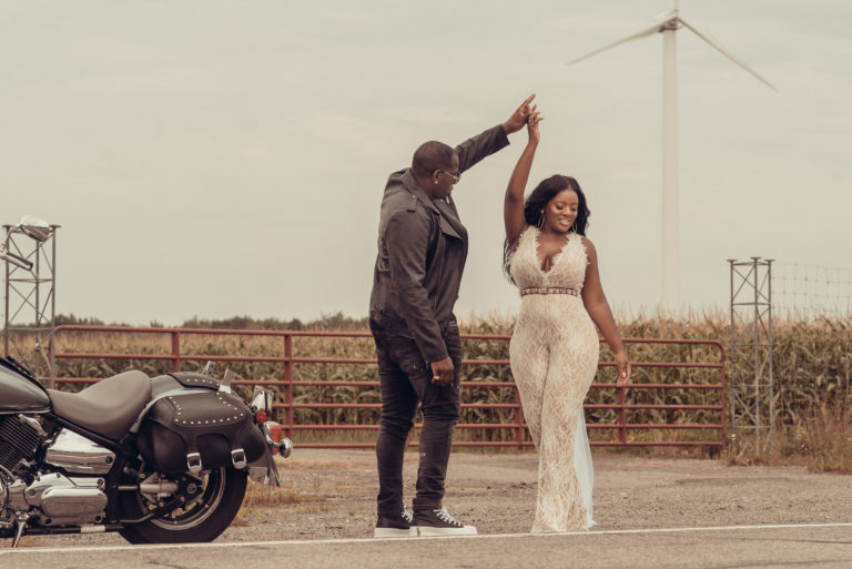 buffalo engagement photos of couple dancing in the street